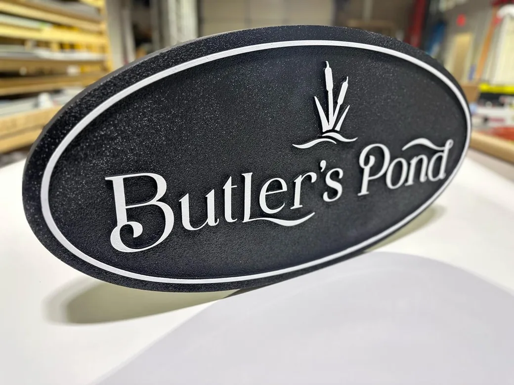 Butlers Pond Black White Oval Sign