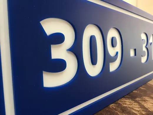 Blue dimensional building number sign