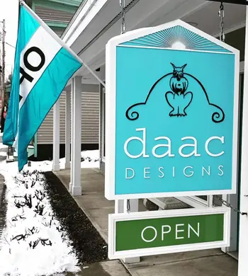 DAAC Designs hanging storefront sign