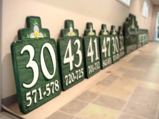 Green dimensional apartment building number plaques