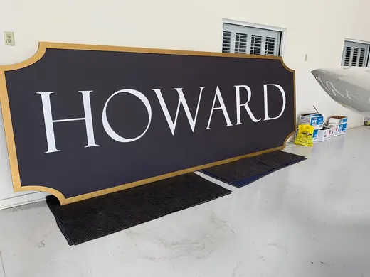 Howard custom routed sign panel with gold border