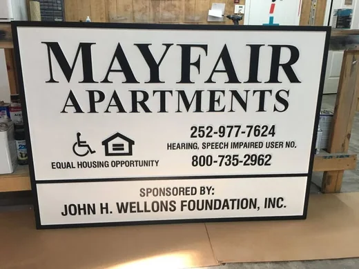 Mayfair Apartments property information sign with dimensional border, lettering and accessibility symbols