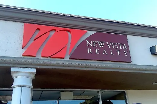 New Vista Realty exterior building logo letters