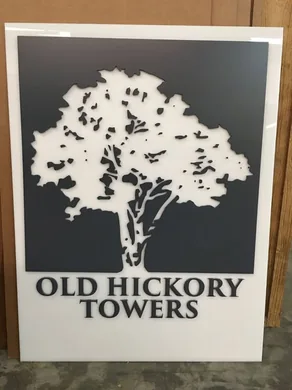 Old Hickory Towers layered property sign with cut tree silhouette and dimensional lettering