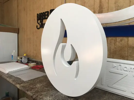 Round dimensional logo sign during fabrication