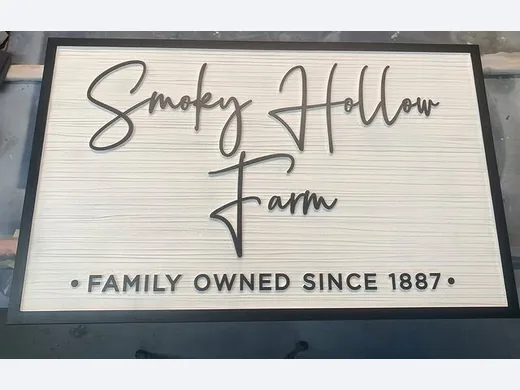 Smoky Hollow Farm black and white dimensional sign with script lettering and family-owned since 1887