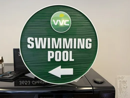 VVC swimming pool directional sign with left arrow
